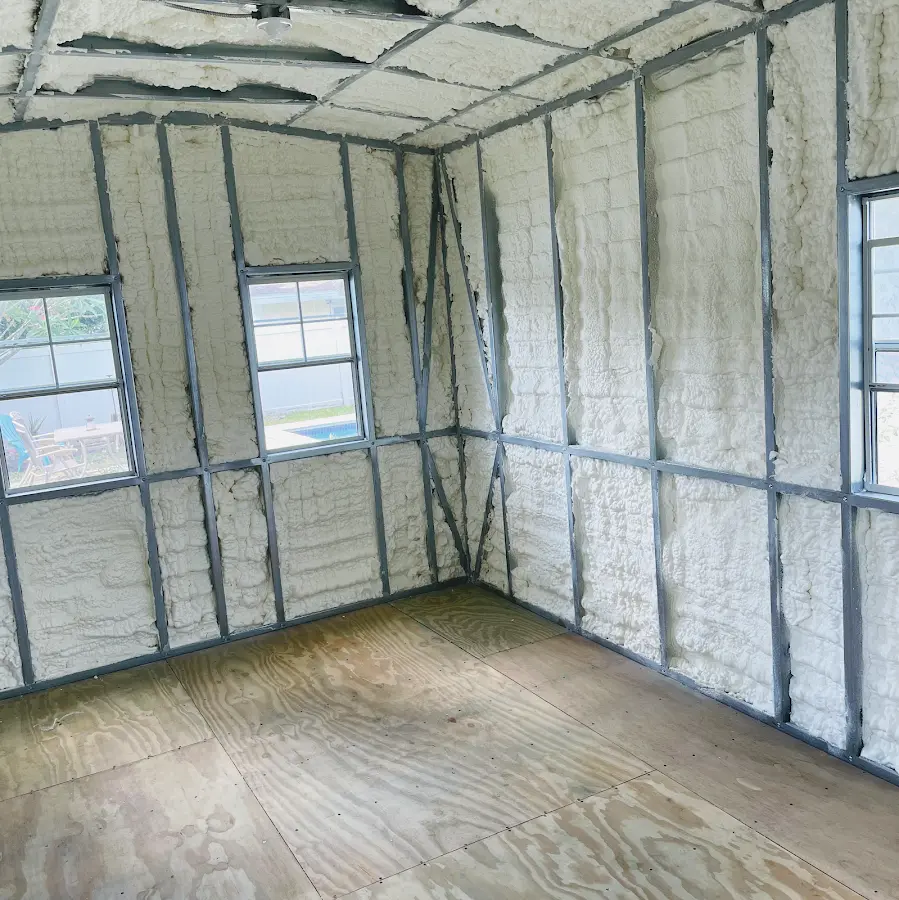 Closed-cell spray foam insulation applied to wall cavities in a residential project in Plainfield